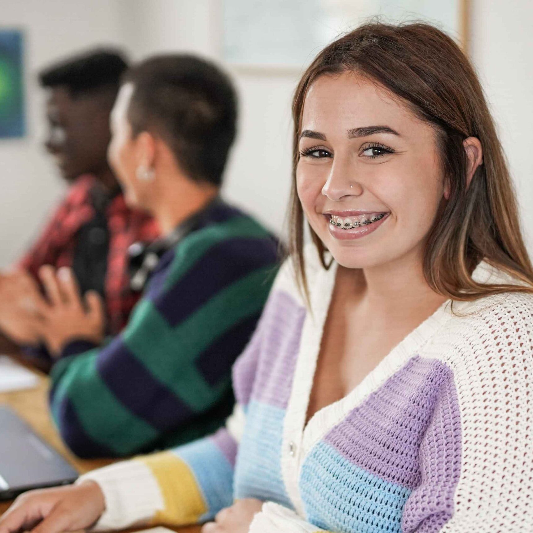 young-female-student-smiling-on-camera-with-braces-2023-11-27-05-07-21-utc